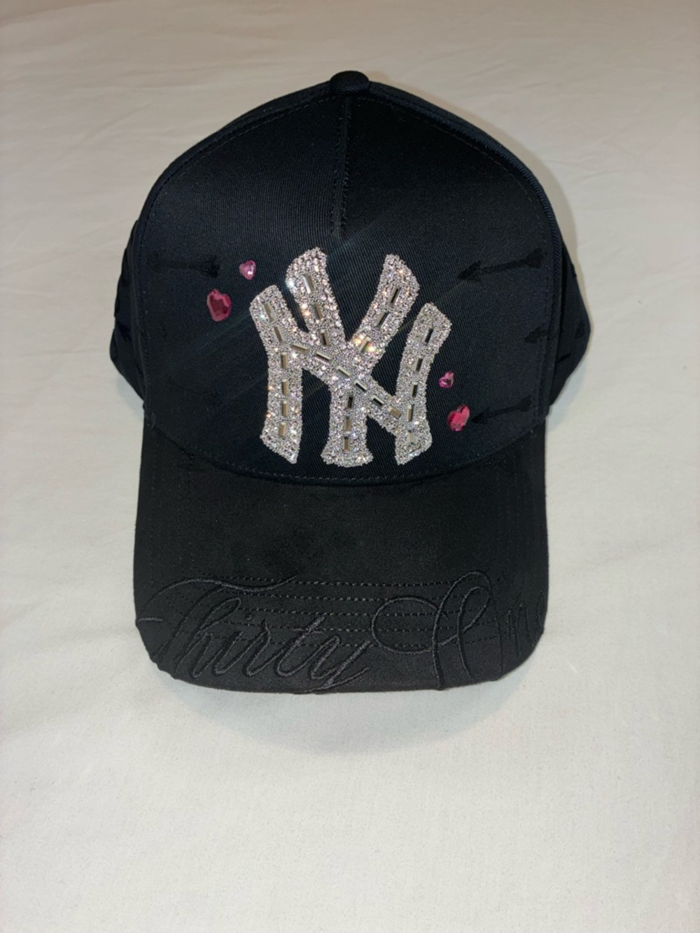 thirty-one Black Cap with Crystal NY and Pink Heart Accents